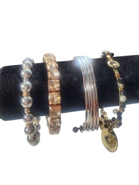 Bundle Of Four Gold and Silver Bangle Bracelet Set.
